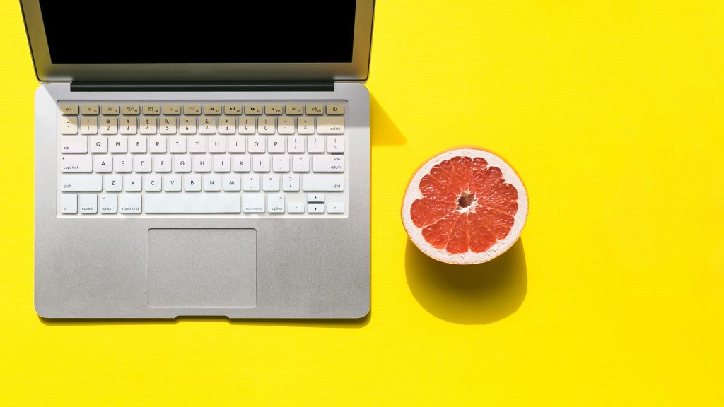 office-desktop-with-a-laptop-and-fruit.jpg